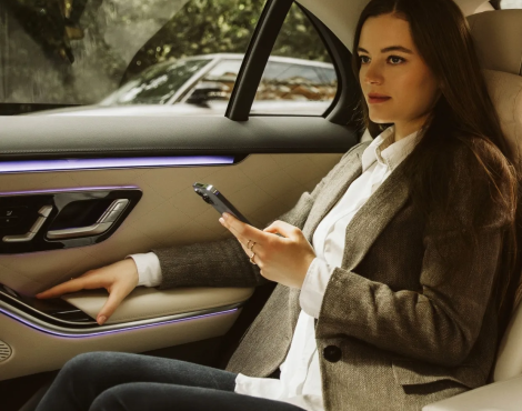 woman in a taxi gets an airport transfer