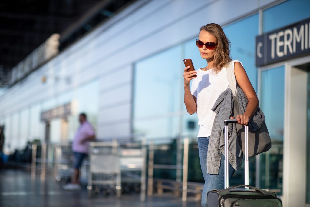 woman is waiting for kefalonia airport transfers service